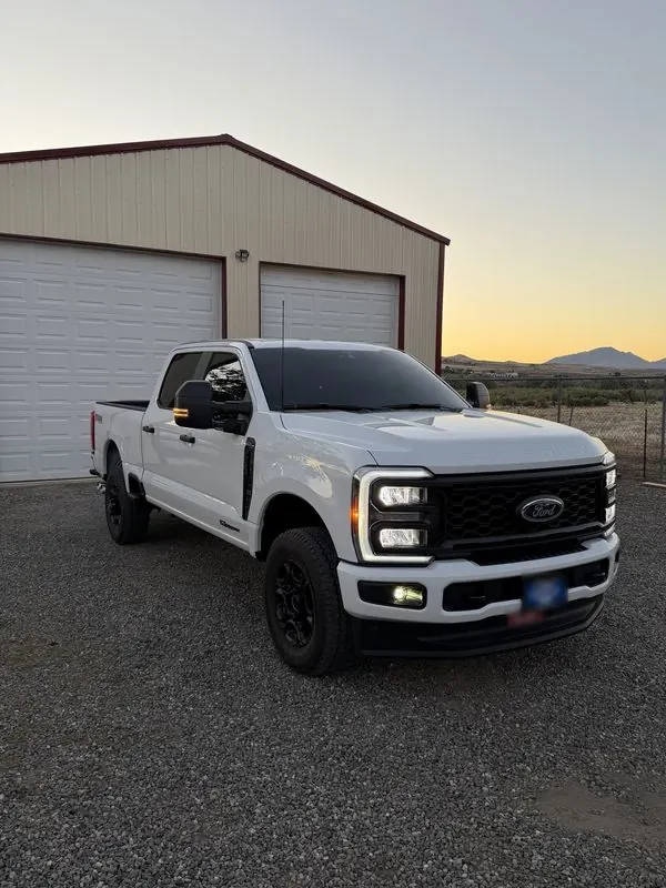 White Ford Super Duty with tinted windows