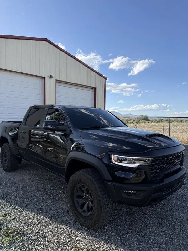 Black Ram pickup with dark tinted windows