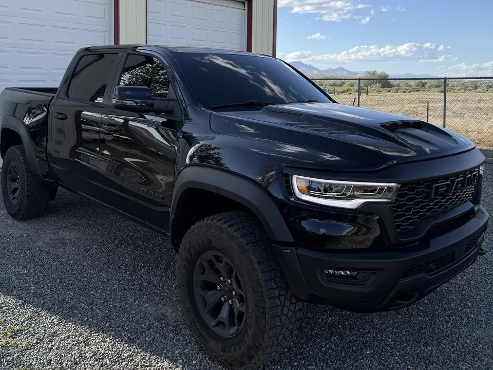 Black Ram pickup with dark tinted windows